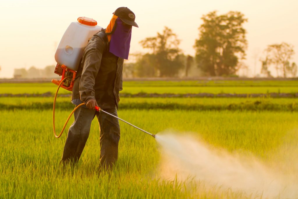 man spraying herbicides